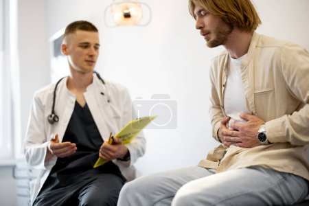 Male patient on appointment with gastroenterologist at medical office. Doctor with man during medical consultation