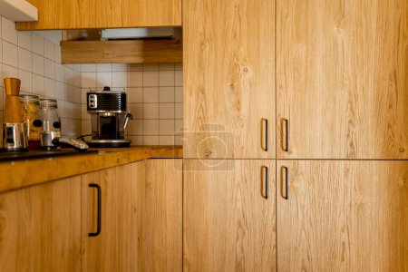 Photo for Close-up of kitchen facades made of oak veneer with black hadles - Royalty Free Image