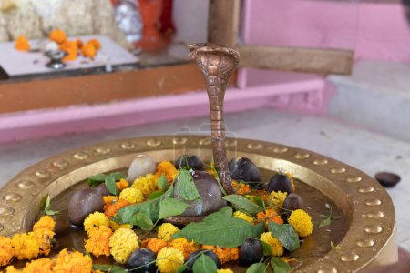 Photo for Hindu god shivalinga worshiped with flower and bell paper at temple - Royalty Free Image