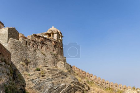 isolated ancient fort stone wall with unique architecture with bright blue sky at morning image is taken at Kumbhal fort kumbhalgarh rajasthan india.