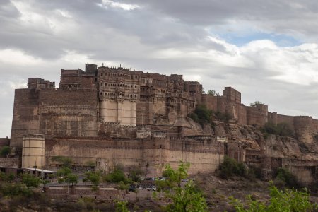ancient historical fort with dramatic cloudy sky at evening from different angle image is taken at mehrangarh fort jodhpur rajasthan india.