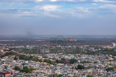 city with historical place and misty sky at evening from mountain top image is taken at mehrangarh fort jodhpur rajasthan india.