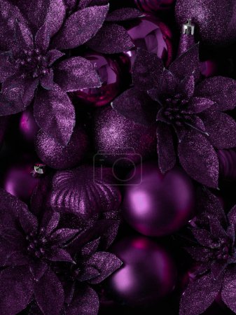 Photo for Purple Christmas balls and flowers.background for the inscription.Christmas background. New year concept. View from above.Merry christmas and Happy New Year card with Space for text.selective focus - Royalty Free Image