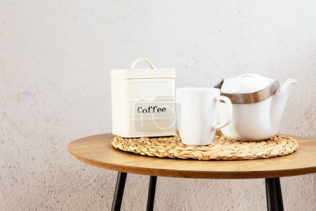 Coffee set on wooden table against white wall. Rustic and vintage style. Copy space. Horizontal.