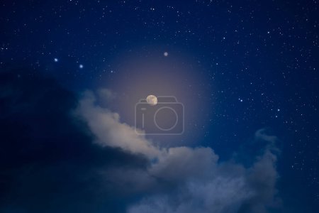 Shining moon in a night sky with clouds and stars Poster 651709408