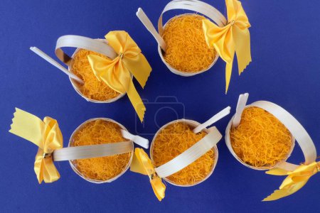 Photo for Dessert made from egg yolks , Thai traditional cuisine dessert from yolk , sweet coconut milk and brown sugar call Thai desserts "Foi Thong" (golden egg yolks threads)  on banana leaf background - Royalty Free Image