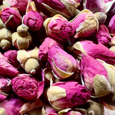 Photo for The beauty of dried roses on a granite floor - Royalty Free Image