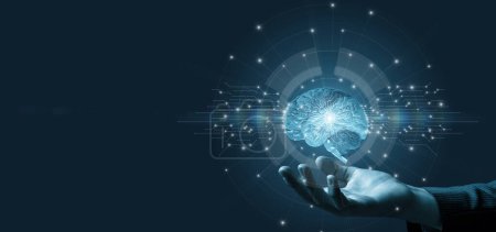 Foto de The hand shows the brain of artificial intelligence on a blue background. - Imagen libre de derechos