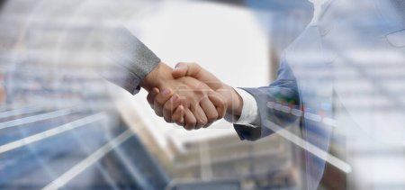 Photo for Businessmen shake hands on the background of the business center. - Royalty Free Image