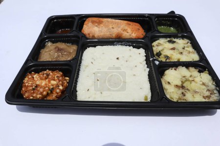 Photo for Indian UPwas thali, traditional fasting food platter or thaali. Farali Upwas food eaten during vrat - Royalty Free Image