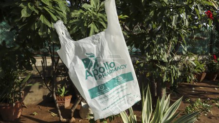 Photo for Apollo Pharmacy home delivery bag. Biodegradable Eco Friendly Plastic bag.Compostable thin polythene bag - Royalty Free Image