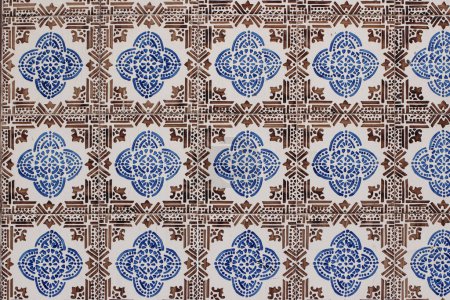 Photo for Blue and brown Portuguese ceramic tile pattern, azulejos. Beautiful shabby facade, wall decoration of old Lisbon building, Portugal. Decorative background, geometric floral ornaments, Moroccan style. - Royalty Free Image