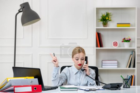 Photo for Secretary in office with work load cute lovely blonde young girl in shirt on phone - Royalty Free Image
