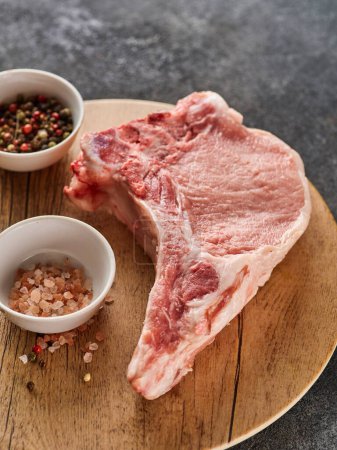 Photo for Raw fresh pork chop. Raw pork cutlet. Organic pork loin chops. Close-up. - Royalty Free Image