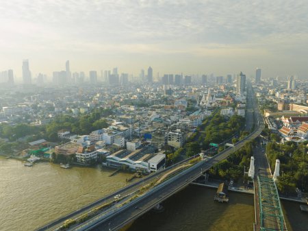 Photo for Aerial view of Phra Buddha Yodfa Bridge, Memorial Bridge and Phra Pok Klao Bridge over the Chaophraya River at sunrise scene, Bangkok City, Thailand. - Royalty Free Image