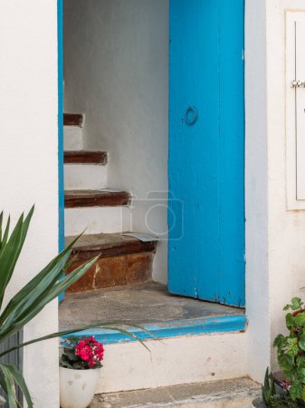 Typical wooden door and stairs to a house in the old historic center of Ibiza, Balearic Islands, Spain