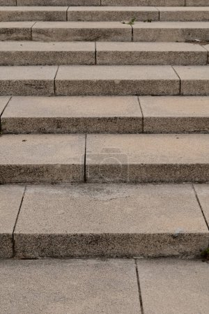 Photo for A detailed view of a rectangular set of stone stairs, showcasing the beige brickwork and the sturdy building material. - Royalty Free Image