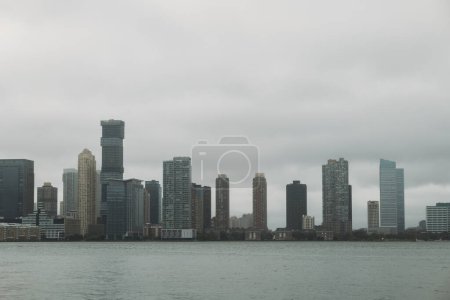 A panoramic view of the citys waterfront buildings on a gloomy day.