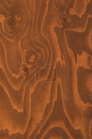 Photo for The image captures the rich, warm tones and natural grain patterns of a wooden surface, highlighting the beauty of organic textures - Royalty Free Image