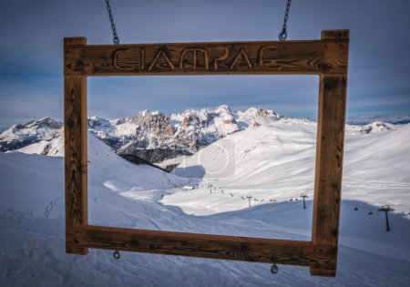 Ciampac ski area near Marmolada glacier, Val di Fassa, Dolomites, Italy. Beautiful view on the mountains through photo frame. January 2024