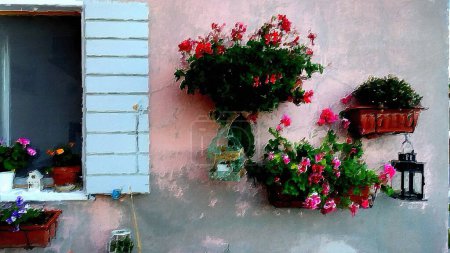 Foto de Una ventana abierta adornada con flores en la estrecha calle de un casco antiguo. - Imagen libre de derechos
