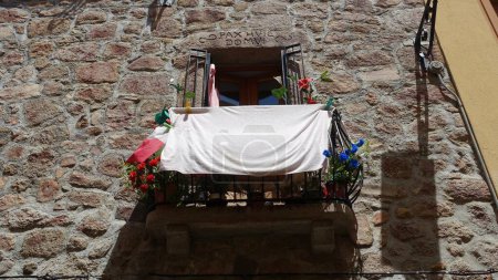Photo for Olbia, Sardinia, Italy, August 03 2021. A balcony with the colors of the Italian flag, on a building in the historic center of the city. - Royalty Free Image