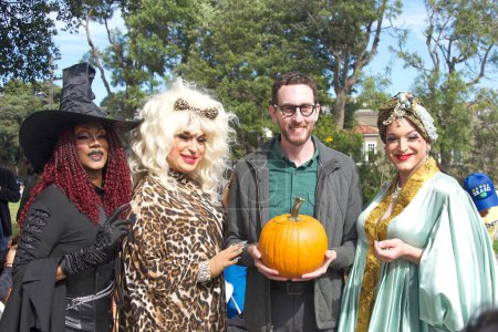 Photo for San Francisco, CA - Oct 22, 2022: Senator Scott Wiener with participants at his Halloween Pumpkin Carving Event at Noe Courts park. - Royalty Free Image
