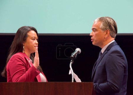 Photo for Oakland, CA - Jan 9, 2023: Attorney General Rob Bonta administering the oath of office to Oakland Mayor Sheng Thao. Inauguration ceremony. - Royalty Free Image