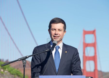 Photo for San Francisco, CA - Jan 23, 2023: Transportation Secretary Pete Buttigieg speaking at a Press Conf in front of the GGB. Highlighting the fed governments investments in infrastructure. - Royalty Free Image