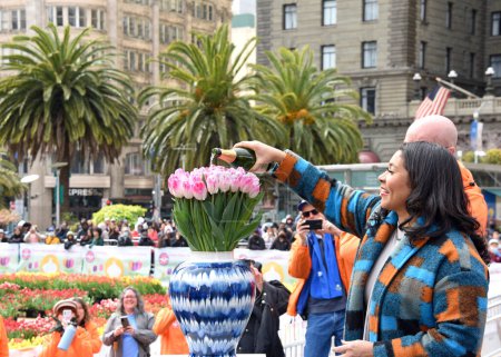 Photo for San Francisco, CA - March 4, 2023: Mayor London Breed at Union Square where 80,000 tulips are being given out for National Womens Day. - Royalty Free Image