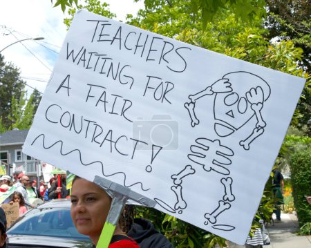 Photo for Oakland, CA - May 11, 2023: Teachers and Parents holding signs at the Teacher Strike day 6 Rally outside Glenview Elementary School. - Royalty Free Image