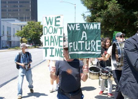 Photo for San Mateo, CA - Aug 5, 2023: Participants in Youth lead climate strike marching in San Mateo around Central Park, holding signs and with demands to address climate change - Royalty Free Image