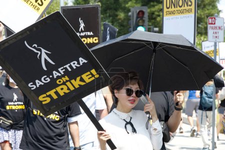 Photo for Los Gatos, CA - Aug 22, 2023: Northern California local members of SAG-AFTRA strike in solidarity with the Writers Guild of America in front of the Netflix building on Winchester Blvd - Royalty Free Image