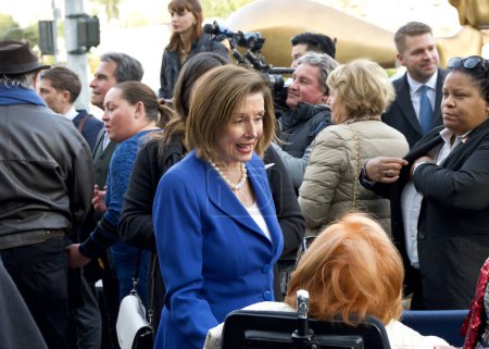 Photo for San Francisco, CA - Dec 15, 2023: Nancy Pelosi speaking with participants at the street dedication ceremony for Michael Tilson Thomas, music director laureate. - Royalty Free Image
