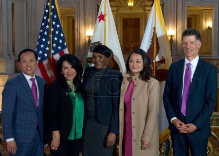 Photo for San Francisco, CA - Jan 31, 2024: BAARC members David Chu, Gilda Gonzales, Kimberly Ellis, Carmen Chu and Dr Grant Colfax posing for group photo after the press conference. - Royalty Free Image
