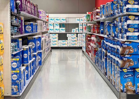 Photo for Alameda, CA - Feb 14, 2022: Grocery store shelves with multipacks of Charmin  and generic toilet paper rolls. - Royalty Free Image