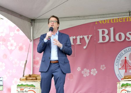 Photo for San Francisco, CA - April 13, 2024: District 5 Supervisor Dean Preston speaking at opening ceremony for the Cherry Blossom Festival in Japantown. - Royalty Free Image