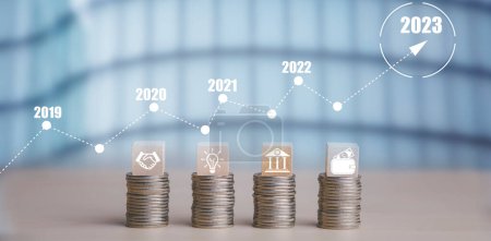 Double exposure of coins on the white background for finance and banking and Money spending planning, and investment budget, Business saving money concept, Copy space, new year 2022-2023 concept-stock-photo