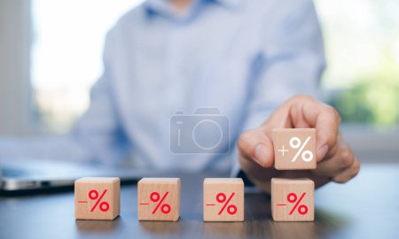 Photo for Man chosen cube with check percent symbol printed on its one side, viewed in close-up, Interest rate financial and mortgage rates, Increasing interest rates or discount sale concept,sale and discount - Royalty Free Image