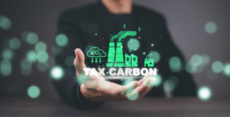 businessman touching icon Co2 Tax.Carbon tax concept , environmental and social responsibility business concept. Taxation for nature pollution.