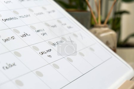 Photo for Monthly PLANNER filled with appointments and plans for next month. Busy month schedule. Magnetic board with the days of the month. Place to enter important matters schedule. Concept for business - Royalty Free Image