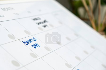 Photo for BASTILLE DAY on calendar to remind important event or holiday appointment Monthly PLANNER. Magnetic board with the days of the month. Place to enter important matters schedule. Concept for business - Royalty Free Image