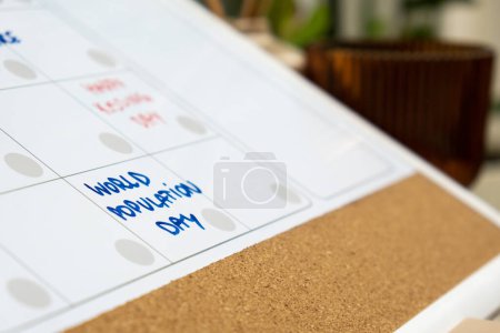 Photo for WORLD POPULATION DAY on calendar to remind important event or holiday appointment Monthly PLANNER. Magnetic board with the days of the month. Place to enter important matters schedule. Concept for - Royalty Free Image
