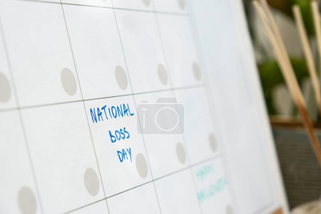 Photo for NATIONAL BOSS DAY on calendar to remind important event or holiday appointment Monthly PLANNER. Magnetic board with the days of the month. Place to enter important matters schedule. Concept for - Royalty Free Image