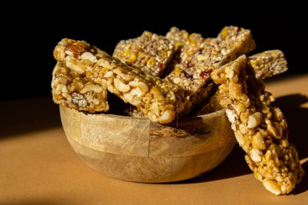Foto de Homemade natural Granola energy bar. Variety of homemade Protein granola breakfast bars with nuts, raisins dried cherries and chocolate. Healthy nutrition eating. Gluten free cereal dieting snack - Imagen libre de derechos
