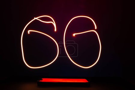 Photo for Abstract red lines long exposure light shape of 6G. Network internet mobile wireless business concept Innovations in the future 6G cellular and Internet speeds. - Royalty Free Image