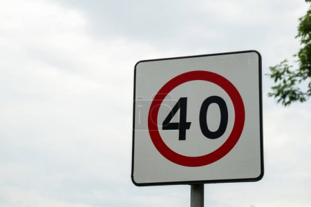 Photo for Speed limit sign with blue sky background. European Speed limit sign 40 km per hour. City zone attention road sign. Outdoor traffic sign - Royalty Free Image
