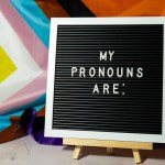 MY PRONOUNS ARE text Neo pronouns concept on Rainbow flag background gender pronouns. Non-binary people rights transgenders. Lgbtq community support assume my gender, respect pronouns tolerance equal