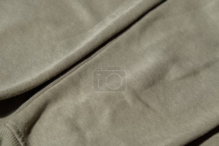 Photo for No Lints on green sweater. After cleaning and collected fluff lint. Closeup Pilled Clothes. Old used Clothes without lint pilling. Restoration of old damaged care. Repairing fabric textile reducing - Royalty Free Image