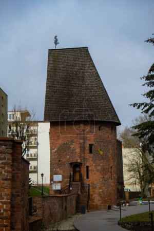 Photo for Round tower in the historic surrounding city wall of Slupsk, Poland. Witches tower - Baszta Czarownic in Slupsk. Sights of Poland. Old jail. Travel destination. Tourist attraction - Royalty Free Image